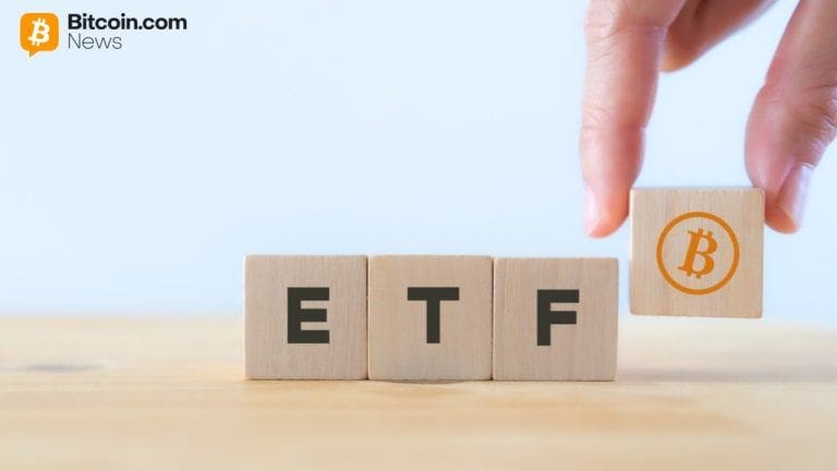 ETF written on wooden blocks with a bitcoin logo
