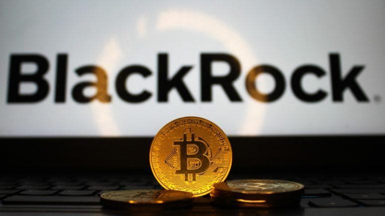 Bitcoin with Blackrock logo in the background