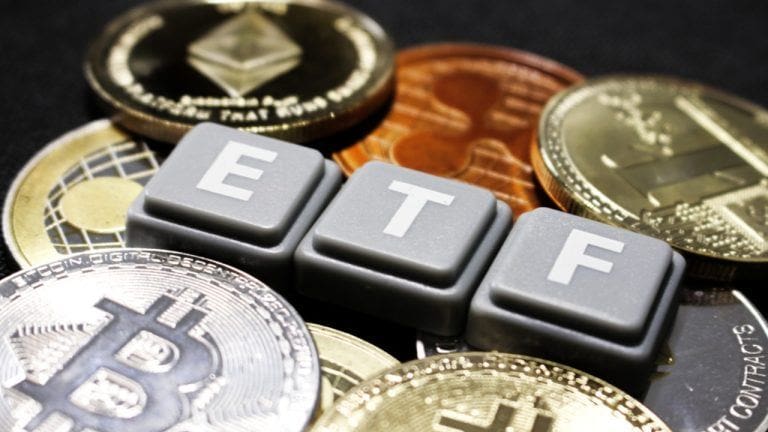 ETF text with bitcoin and ether around it