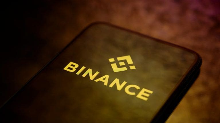 Binance logo in phone