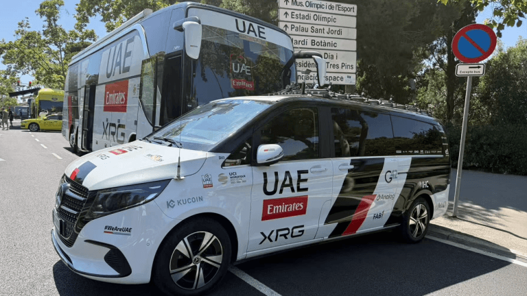 UAE Team Emirates and Kucoin branded vehicles.